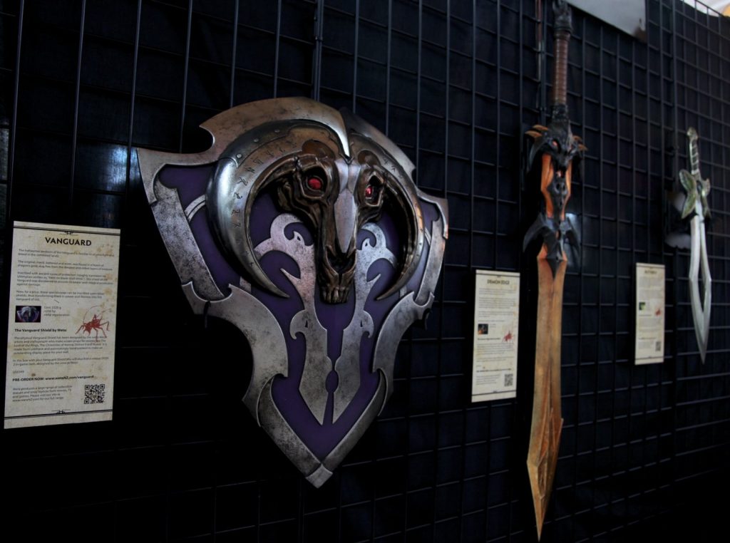 Physical replica props of Dota 2 items, with Vanguard in front, at The International 2012