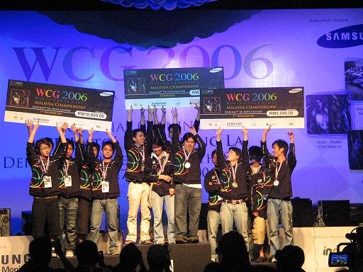 Winners of a Warcraft III DotA competition at WCG Malaysia 2006